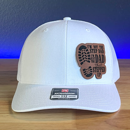 I'M NOT THE STEP DAD, IM THE DAD THAT STEPPED UP Leather Patch Trucker Hat White