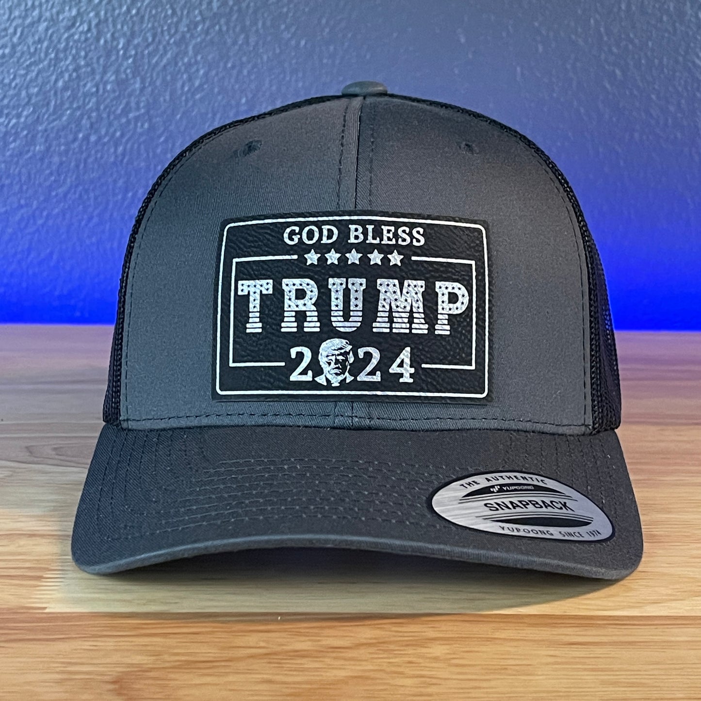 GOD BLESS TRUMP 2024 SnapBack Trucker Leather Blk/Silver Rectangular Patch Charcoal Hat