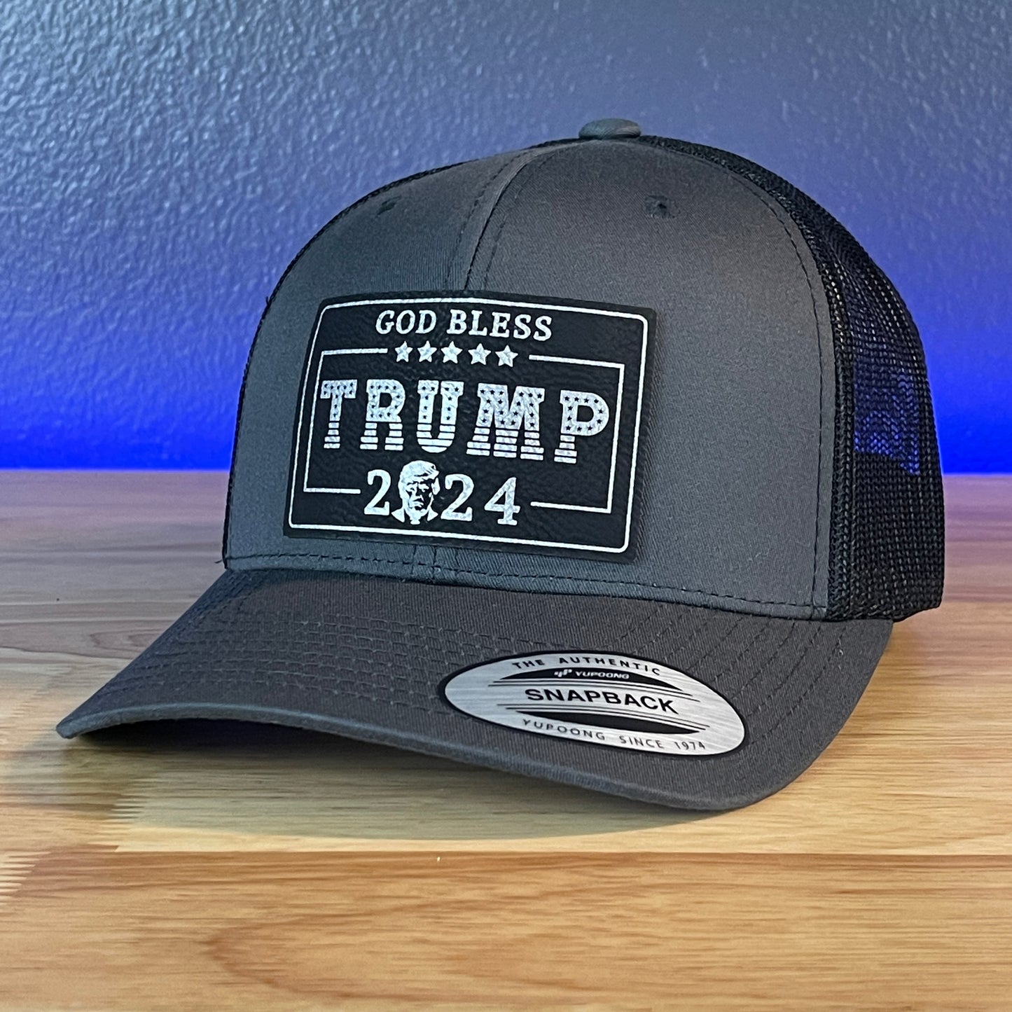 GOD BLESS TRUMP 2024 SnapBack Trucker Leather Blk/Silver Rectangular Patch Charcoal Hat