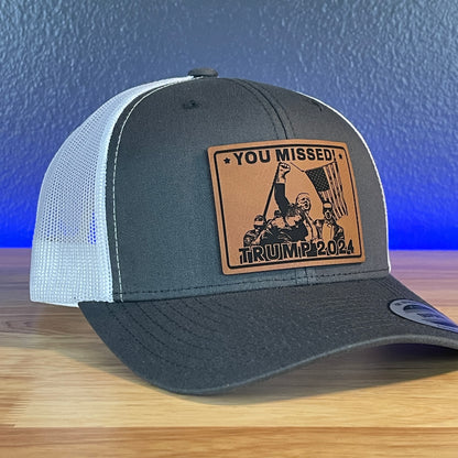 You Missed Trump 2024 SnapBack Trucker Hat Square Rawhide Leather Patch Charcoal/White