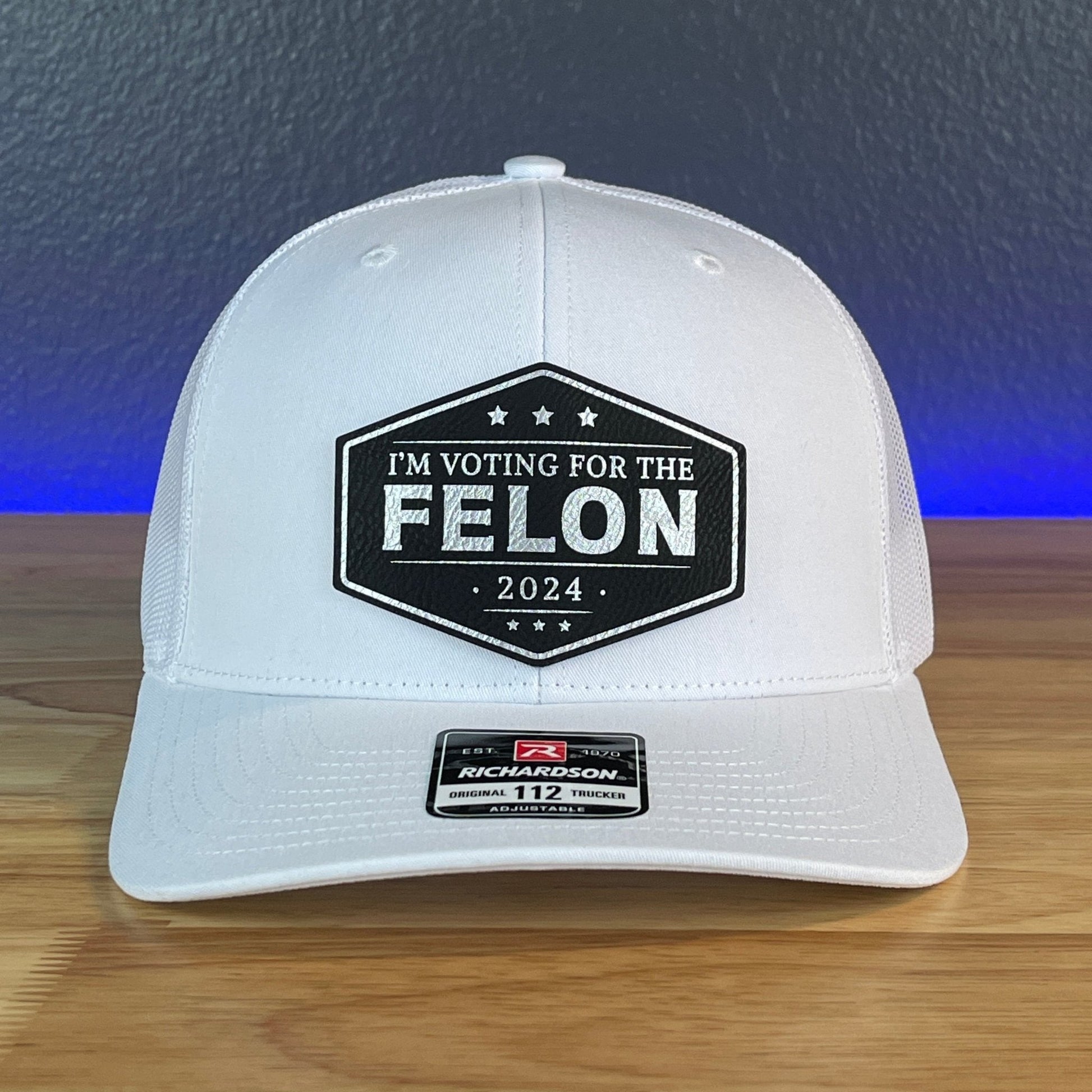 IM VOTING FOR THE FELON Trump 2024 Leather Patch SnapBack Trucker Hat Black/Silver - Hollow Point Society