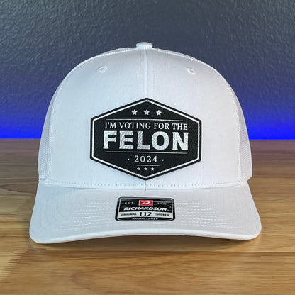 IM VOTING FOR THE FELON Trump 2024 Leather Patch SnapBack Trucker Hat Black/Silver - Hollow Point Society