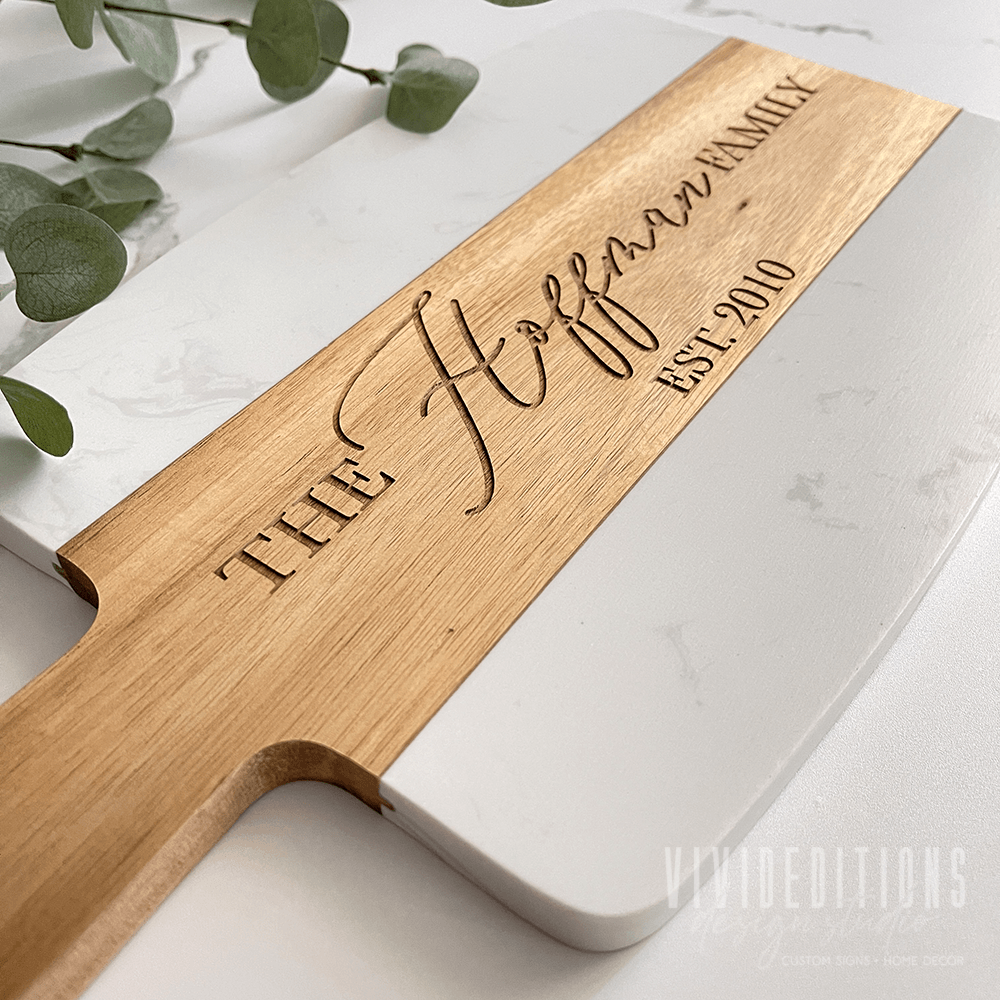 https://www.vivideditions.com/cdn/shop/products/marble-acacia-wood-serving-charcuterie-board-6-design-options-vivideditions-381289.png?v=1691161733&width=1445
